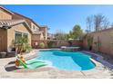 Inviting backyard pool and spa with lounge chairs, perfect for outdoor relaxation and entertaining at 1033 Via Dell Bacio Dr, Henderson, NV 89052