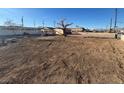 Wide angle of the home's front yard on a clear day at 1275 Westwind Rd, Las Vegas, NV 89146