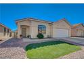 Attractive single-level home with green lawn and desert landscaping plus a two-car attached garage at 1421 Hometown Ave, Henderson, NV 89074