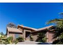 Charming single-story home with a three car garage, desert landscaping, and a bright blue sky at 144 La Mirada Dr, Henderson, NV 89015