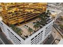 The Trump Tower offers a unique rooftop terrace with palms amid the golden facade at 2000 N Fashion Show Dr # 2021, Las Vegas, NV 89109