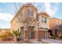 Stylish two-story home featuring modern architecture, desert landscaping, and a cozy entrance at 2149 Morro Vista Dr, Las Vegas, NV 89135