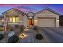 Charming home exterior featuring a well-manicured yard and decorative walkway lighting at 3018 Fall Solstice Ct, Las Vegas, NV 89138