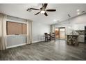 Inviting living space with vaulted ceilings, tile floors, and natural light from sliding glass doors at 3334 Flying Colt Ct, North Las Vegas, NV 89032