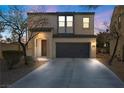 Inviting two-story residence boasting a well-kept lawn, two-car garage, and welcoming entrance at 511 Via Ripagrande Ave, Henderson, NV 89011