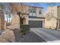 Attractive two-story house featuring stucco siding, a gray roof, and a two-car garage at 511 Via Ripagrande Ave, Henderson, NV 89011