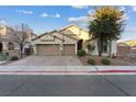 Lovely single-story home with a well-maintained yard, desert landscaping, and a two-car garage at 6944 Puetollano Dr, North Las Vegas, NV 89084