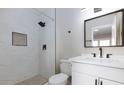 Modern bathroom with a sleek vanity, updated fixtures, and a stylish glass-enclosed shower at 7176 Southpark Ct, Las Vegas, NV 89147