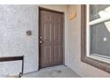 Exterior front door with textured stucco and view of window at 7255 W Sunset Rd # 2007, Las Vegas, NV 89113