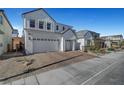 Bright two-story home featuring a three-car garage and stone landscaping at 9007 Antora Summit St, Las Vegas, NV 89166