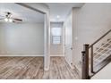 Hallway features wood-look flooring and views to the living area at 183 Baru Belin Ave, Las Vegas, NV 89183