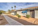 Charming single-story home featuring a tile roof, sidewalk, and simple landscaping at 211 N Lamb Blvd # C, Las Vegas, NV 89110