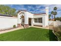 Close-up of a cozy single-story home with red tile roof, a small yard, and decorative stone accents at 230 Pintale Cir, Henderson, NV 89074