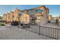 Spacious backyard patio featuring a grill, seating, and low-maintenance gravel landscaping at 2657 Fawn Beige Ct, North Las Vegas, NV 89086