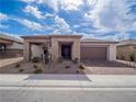 A well-maintained single-story home with neutral tones, rock landscaping, and a two-car garage at 3503 Luca Point Ave, Henderson, NV 89044