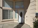 Inviting front entrance with a decorative white door and lots of natural light at 3751 Morning Canyon St, Las Vegas, NV 89147