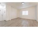 Bright living room boasts light wood floors and natural lighting at 5225 W Reno Ave # 105, Las Vegas, NV 89118