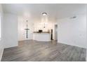 Open-concept living space with light wood floors and bright lighting at 5225 W Reno Ave # 105, Las Vegas, NV 89118