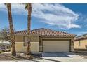 Attractive one-story house with a tile roof, low-maintenance landscaping, and an attached two-car garage at 6035 Eganridge Ct, North Las Vegas, NV 89081