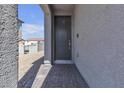 Close-up of the front door entrance with brick-paved walkway at 6832 Upland Heights Ave, Las Vegas, NV 89142