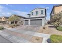 View of the home's front exterior, including the 2-car garage at 6832 Upland Heights Ave, Las Vegas, NV 89142