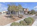 Two-story house with a gray exterior and a well-kept yard at 6832 Upland Heights Ave, Las Vegas, NV 89142