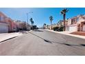 Neighborhood street featuring diverse homes, mature palm trees, and well-maintained landscaping at 7244 Buglehorn St, Las Vegas, NV 89131