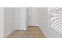 Bright entryway with tile flooring and a white front door and white walls at 7452 Wine Creek St, Las Vegas, NV 89139