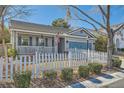 Inviting single-Gathering home with a cozy front porch, neat landscaping, and attached garage at 7835 Meandering Path Ave, Las Vegas, NV 89131