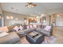 Spacious living room with comfortable seating, a large sectional sofa and carpet at 172 Turtle Ridge Ave, Las Vegas, NV 89183