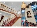 Grand foyer featuring staircase, chandelier, and view of second story at 2212 Barton Mill Ct, North Las Vegas, NV 89084