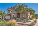 Charming two-story home with a well-manicured front yard and desert landscaping at 2529 Vera Cruz Cir, Henderson, NV 89074