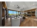 Spacious living room featuring large windows, modern furniture, and hardwood floors at 2548 Faiss Dr, Las Vegas, NV 89134