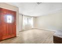 Bright living room featuring a decorative glass window front door, and window at 2647 Jacyra Ave, Las Vegas, NV 89121