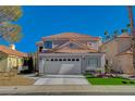 Charming two-story home with a well-manicured lawn, inviting curb appeal, and a two car garage at 3012 Waterside Cir, Las Vegas, NV 89117