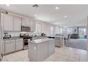 Spacious kitchen featuring stainless steel appliances and granite countertops at 3524 Crotone Ave, Henderson, NV 89044