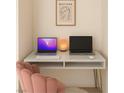 Stylish home office setup with marble desk, modern art, and comfortable pink chair at 353 E Bonneville Ave # 447, Las Vegas, NV 89101