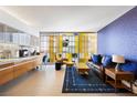 Bright living room featuring a large sliding window, sleek cabinets, and stylish furnishings at 3722 Las Vegas Blvd # 1709, Las Vegas, NV 89158