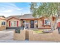 Beautiful single-story home with desert landscaping, shutters, and an inviting entrance at 5005 Harmony Ave, Las Vegas, NV 89107