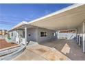 Covered parking area attached to the home provides ample space for vehicles at 513 Elm St, Boulder City, NV 89005
