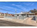 Cozy home with a concrete fence and an attached covered parking area at 513 Elm St, Boulder City, NV 89005