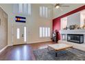 Bright living room with high ceilings, fireplace, and ample natural light at 6686 Enchanted Cove Ct, Las Vegas, NV 89139