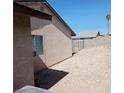 Side yard features a concrete block fence at 6760 Fallona Ave, Las Vegas, NV 89156