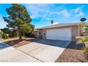 Charming single-story home with a spacious driveway and an attached two-car garage, perfect for families at 7817 Aplin Ave, Las Vegas, NV 89145