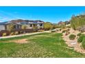 Neighborhood greenbelt featuring walking paths, desert landscaping and mountain views at 8 Via Dolcetto, Henderson, NV 89011