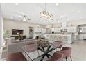 Spacious open-concept living area with dining table, and expansive island, great for entertaining at 10016 Copper Edge Rd, Las Vegas, NV 89148