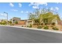 Modern home with desert landscaping and stone accents on a quiet street in a well-maintained community at 10016 Copper Edge Rd, Las Vegas, NV 89148