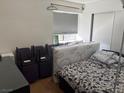 Bedroom featuring a bed, window with blinds, and closet at 201 Fig Ct, Las Vegas, NV 89145