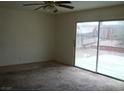 Neutral living area featuring a sliding glass door to the outside at 224 S Wallace Dr, Las Vegas, NV 89107