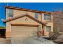 Home exterior shows a tile roof, tan stucco, and 2 car garage at 262 Calvino Ave, Las Vegas, NV 89183